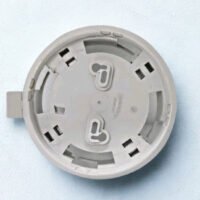 Rear view of Autronica BWA-40A/1 detector base featuring mounting slots and cable entry cut-outs for fire alarm installation