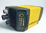 Side profile of Cognex DataMan 825-10841-1R reader featuring the TRIG and TUNE buttons with LED status indicators