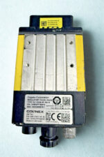 Top view of Cognex DataMan 825-10841-1R 02 model DM474X showing manufacturer label, serial number, and aluminum heat sink
