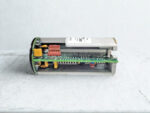 Side profile of DE6000-001 module showing internal PCB components and red connector.