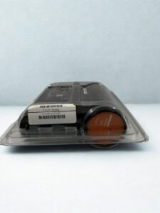 Close-up side view of Honeywell FC-PUIO01 module featuring the orange "Safety UIO" circular cap and serial number barcode label