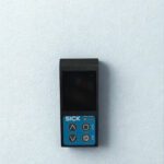 Front view of SICK PRO2-P100B25A1 Displacement Sensor featuring digital display and control buttons for Exit, Set, and Navigation