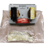 Woodward 2301 Power Supply 8270-201 M displayed on its original protective plastic packaging with visible inventory barcodes for marine automation stock