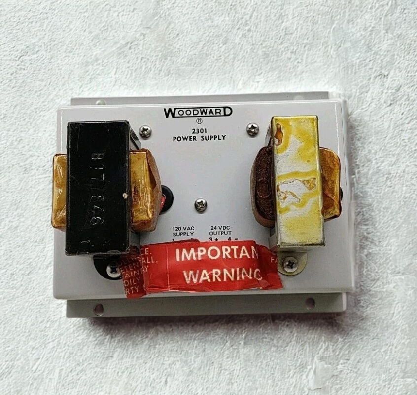 Woodward 2301 Power Supply Front View Front view of a Woodward 2301 Power Supply P/N 8270-201 M showing the dual transformer coils and labeling for 120 VAC supply and 24 VDC output