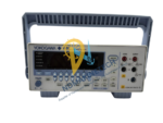 Front interface of Yokogawa GS200 featuring VFD display, output terminals, and tactile control buttons