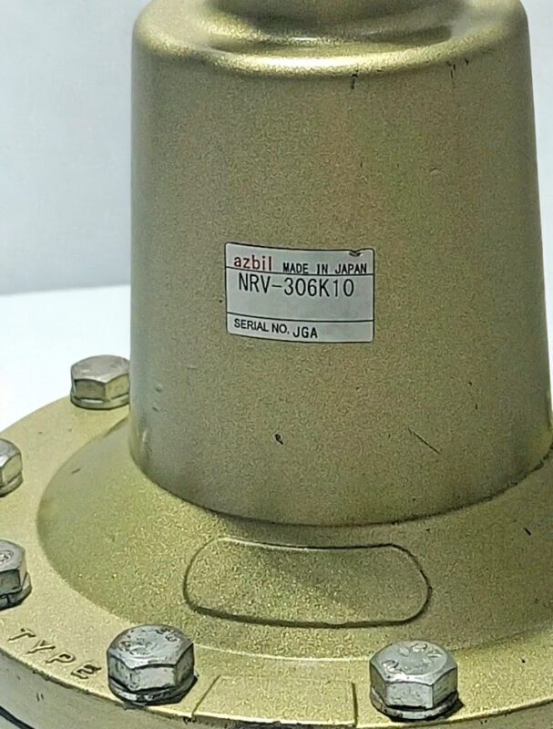 Azbil NRV-306K10 Serial Number and Model Identification Label Close-up of Azbil NRV-306K10 manufacturer label showing Model Number and Made in Japan quality mark