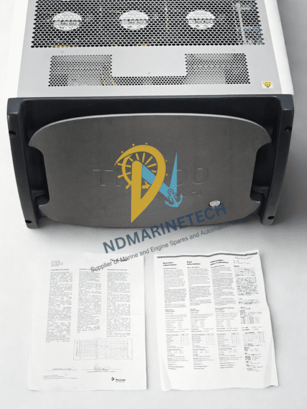 Aeroflex TM500 Test Mobile with Instruction Manuals Front view of the Aeroflex TM500 test unit featuring a grey protective faceplate with a power button, accompanied by printed instruction manuals laid out in front