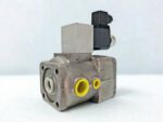 A perspective view of an Aventics R417002149 solenoid valve showing the cast metal body, yellow protective port plugs, and the black electrical connector mounted on top.