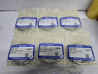 Daihatsu Intake Valve Seats (E205600060Z) Six individually packaged metal valve seat rings with blue Daihatsu genuine parts labels indicating Seat, Intake Valve, part number E205600060Z.