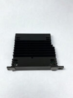 Side profile of the GE IS220UCSAH1A UCSA-H1A controller illustrating the passive convection cooling heatsink fins and baseplate panel mounting slots.