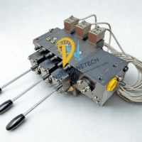 Overhead view of the Hawe PSV 51 series valve manifold featuring three manual control levers and electro-hydraulic actuators
