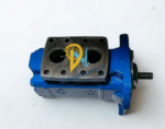 Top-down view of the mounting flange and fluid ports of a blue IMO screw pump, showing the internal chambers and bolt hole pattern
