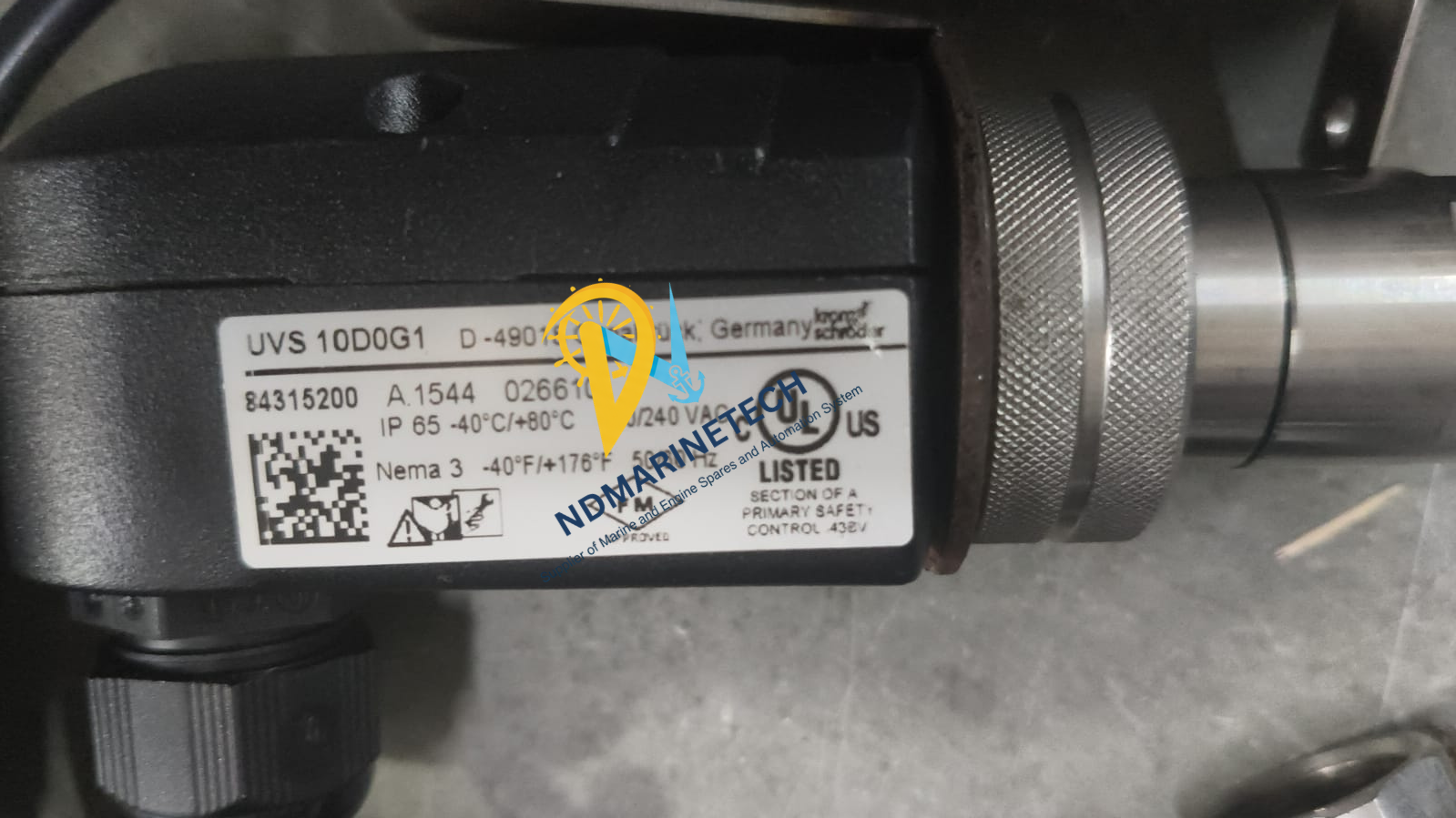 Kromschröder UVS 10D0G1 Flame Sensor(1) Kromschröder UVS 10D0G1 UV Flame Sensor label showing MPN 84315200 and IP65 rating on a black industrial housing.