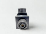 Side view of Parker D1VW004CNYW91 valve solenoid showing manual override pin and rugged industrial casing.
