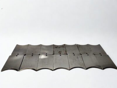 Bulk Supply of Pell POC2500-4 Cutter Tool Blades Multiple Pell POC2500-4 hydraulic cable cutter replacement blades laid out showing consistent manufacturing and mounting hole alignment.