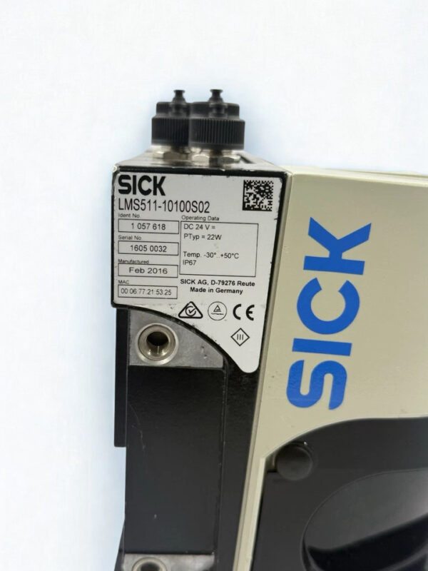 Close-up of SICK LMS511-10100S02 Model Specifications and Manufacturing Data Detailed view of SICK LMS511-10100S02 nameplate with manufacturing date Feb 2016 and operating voltage DC 24V