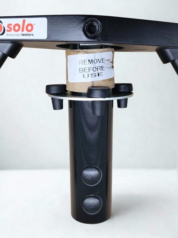 SOLO 200-001 Mounting Stem and Security Locking Mechanism Close-up of the SOLO 200-001 attachment pole connection with "Remove Before Use" safety label.