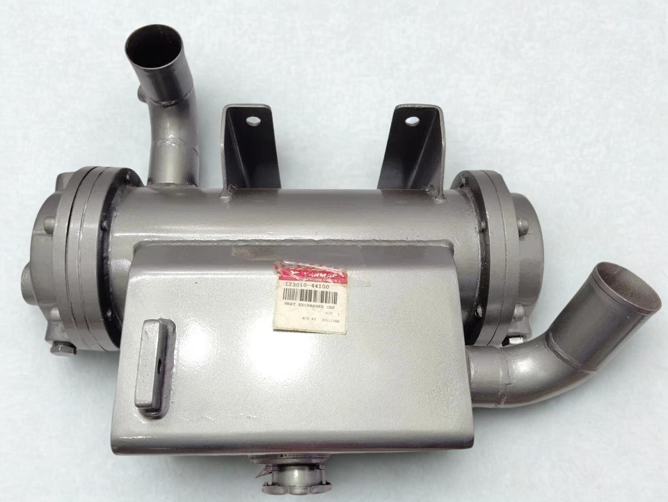 Yanmar 123010-44100 Marine Heat Exchanger Full Assembly Full top-down view of the Yanmar 123010-44100 Heat Exchanger CMP showing mounting brackets and cooling pipe orientation.