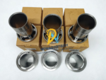Top-down view of six Carrier 5H40 cylinder liners showing the precision honed internal bores and unloader lift pin holes on brown packaging boxes.