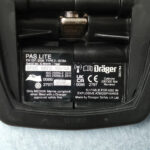 Dräger PAS Lite SCBA technical label detailing EN 137:2006 Type 2 compliance, serial prefix BRSC, MED/UK Marine compliance for 2023, and explosive atmosphere safety.