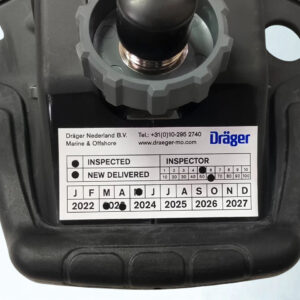 Dräger Marine and Offshore inspection verification label. Dräger Nederland B.V. Marine & Offshore inspection sticker from showing punched validation dots for an 'INSPECTED' unit from March 2023.