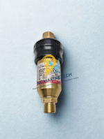 Close-up of Drew Marine PCN 548026 Oxygen Backfire Valve showing brass body, technical specifications label, and ISO 5175 compliance markings.