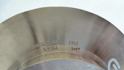 Goulds Impeller 745743 Part Markings and Heat Number Close-up Close-up of engraved serial numbers D02662A01 and heat number K4422 on a Goulds 9 inch stainless steel impeller 745743.