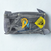 Honeywell CC-TAID01 Analog Input IOTA board inside a sealed anti-static protective bag with a yellow ESD warning label, showing the rear circuit traces and components.
