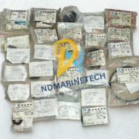 Comprehensive inventory of genuine Mitsubishi Diesel Oil Purifier SJ10G spares, including OEM-packaged bowl seals, NTN bearings, gear pump bushes, and horizontal shaft accessories arranged as a complete maintenance overhaul lot.