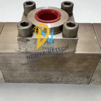 High-pressure NOV-SCHAFFER DTL ENGR 1710-4100 shuttle valve housing block with stamped 2X923 serial numbers and heavy-duty socket head flange bolts.