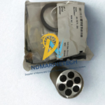 Genuine NOV Shaffer 7401935 repair kit sealed in original OEM packaging alongside a precision-machined stainless steel multi-port SPM valve component for marine and offshore drilling applications.
