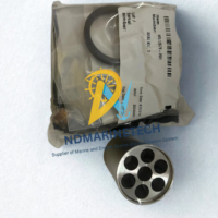 Genuine NOV Shaffer 7401935 repair kit sealed in original OEM packaging alongside a precision-machined stainless steel multi-port SPM valve component for marine and offshore drilling applications.