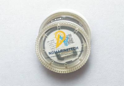 RIKEN KEIKI IRF-C4H10 Hydrocarbon Sensor in Protective Casing RIKEN KEIKI IRF-C4H10 gas sensor model IRF-4345 enclosed in a clear, round protective storage capsule showing the product label.