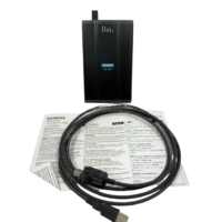 Siemens 6GK1571-1AA00 CP 5711 communication processor kit including industrial USB cable and printed manual.