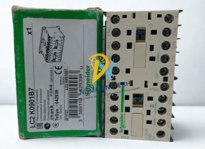 schneider-electric-lc2k0901b7-reversing-contactor-with-box Schneider Electric TeSys K LC2K0901B7 24V 50/60Hz reversing contactor assembly standing next to its original green product packaging box.