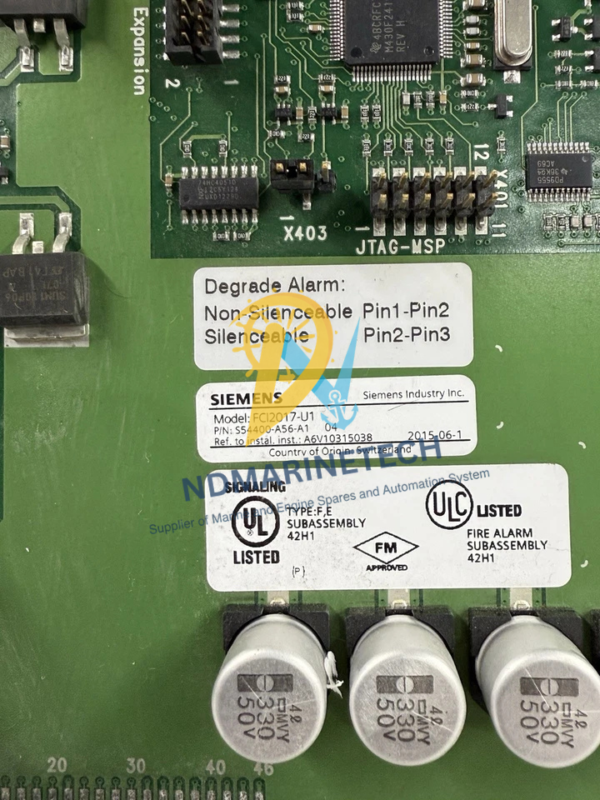 Siemens FCI2017-U1 Board Specifications and Jumpers Close-up of a Siemens FCI2017-U1 fire alarm subassembly printed circuit board showing technical specification labels, UL and FM approvals, degrade alarm pin configurations, and electrolytic capacitors.