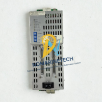 Front overhead perspective of Siemens FireFinder XLS PSC-12 primary power supply module highlighting its ventilation casing, ribbon cable ports, and master battery breaker switch.