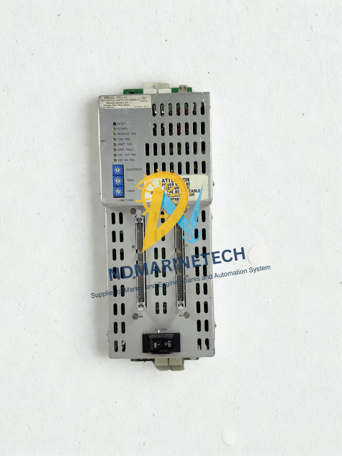 Siemens PSC-12 FireFinder XLS Front overhead perspective of Siemens FireFinder XLS PSC-12 primary power supply module highlighting its ventilation casing, ribbon cable ports, and master battery breaker switch.