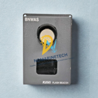 Front view of Tokyo Keiki ALP-001 BNWAS Flash Beacon featuring the high-intensity visual alarm lens and gray marine-grade housing.