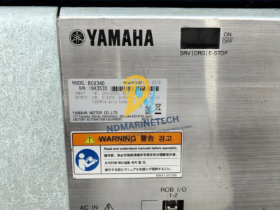 Yamaha RCX340 Robot Controller Nameplate Specifications Yamaha RCX340 robot controller technical specification nameplate showing model details, input-output voltages, and serial number.