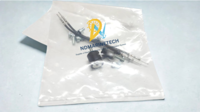 ABB 1VCF309499S0012 Installation Hardware and Accessories Internal hardware installation kit for ABB 1VCF309499S0012 control module including anti-vibration rubber mounts, connecting pins, and mounting screws in a sealed packet.