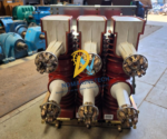 Rear perspective of the ABB HD4.W 12.12.32 circuit breaker showing six primary tulip finger cluster contacts and red embedded pole casings.