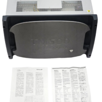 Front view of the Aeroflex TM500 test unit featuring a grey protective faceplate with a power button, accompanied by printed instruction manuals laid out in front