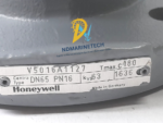 Close-up of the metal nameplate on a Honeywell V5016A1127 valve, displaying technical specifications: Centra Type, DN65, PN16, Kvs 63, Tmax 180°C, and Made in Germany.