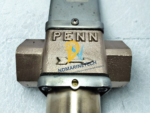 Detailed view of the cast PENN brand logo and directional fluid flow arrow on the bronze body of the V46BD-9510 marine valve.
