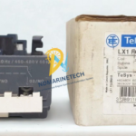 Telemecanique LX1FG380 replacement coil for TeSys F contactor standing next to its original Schneider Electric factory packaging box with barcode label.