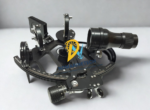 Perspective view of GLH130-40 celestial navigation instrument detailing index mirror, horizon mirror, adjustable shade glasses, and optical telescope.