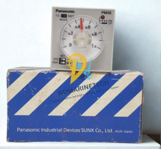 Panasonic PM4S-A2C10M-AC120V Analog Timer with Original Packaging Panasonic PM4S-A2C10M-AC120V industrial time delay relay positioned on top of its original blue and white Panasonic Industrial Devices box packaging.