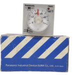 Panasonic PM4S-A2C10M-AC120V industrial time delay relay positioned on top of its original blue and white Panasonic Industrial Devices box packaging.