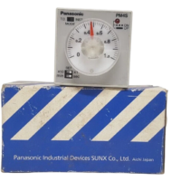 Panasonic PM4S-A2C10M-AC120V industrial time delay relay positioned on top of its original blue and white Panasonic Industrial Devices box packaging.